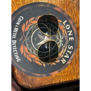 vintage round shooting glasses with gold-tone frames and dark lenses